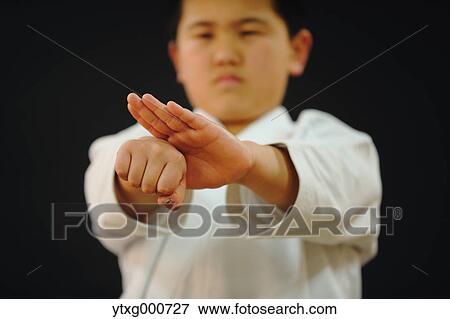 Japanese kid in karate uniform on black background View Large Photo Image Stock Photo - Japanese kid in karate uniform on black background. Fotosearch