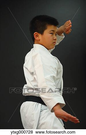 Japanese kid in karate uniform on black background View Large Photo Image Stock Photo - Japanese kid in karate uniform on black background. Fotosearch
