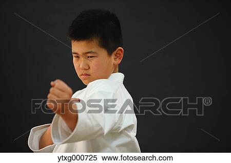 Japanese kid in karate uniform on black background View Large Photo Image Stock Photography - Japanese kid in karate uniform on black background. Fotosearch