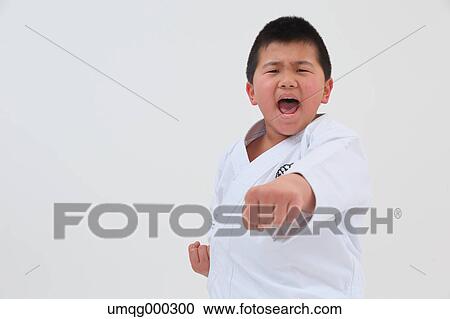 Japanese kid in karate uniform on white background View Large Photo Image Stock Image - Japanese kid in karate uniform on white background. Fotosearch
