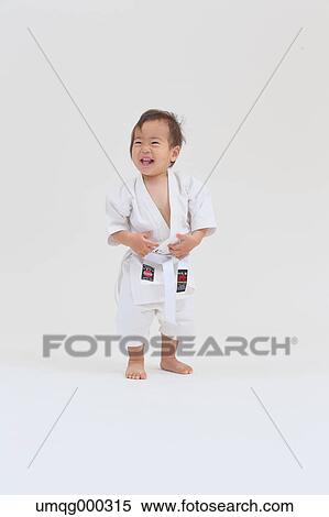 Japanese kid in karate uniform on white background View Large Photo Image Stock Photography - Japanese kid in karate uniform on white background. Fotosearch