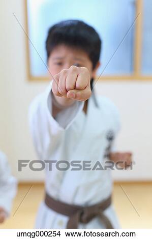 Japanese kid in karate uniform training View Large Photo Image Picture - Japanese kid in karate uniform training. Fotosearch