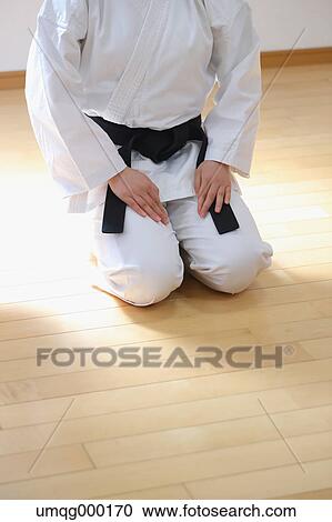 Stock Image - Japanese kid in karate uniform training. Fotosearch