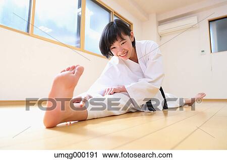 Stock Image - Japanese kid in karate uniform training. Fotosearch