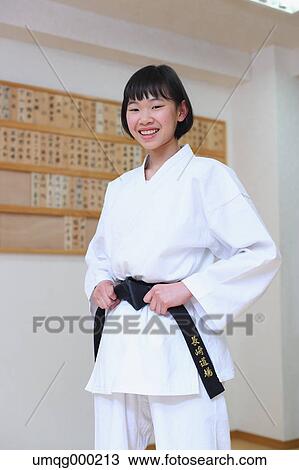 Stock Image - Japanese kid in karate uniform training. Fotosearch