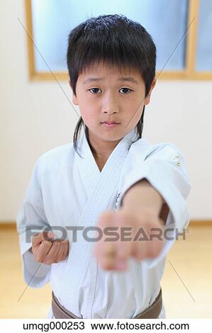Japanese kid in karate uniform training View Large Photo Image Stock Image - Japanese kid in karate uniform training. Fotosearch