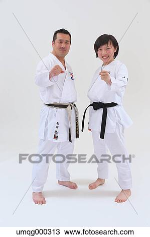 Japanese kid in karate uniform training with teacher on white background View Large Photo Image Stock Image - Japanese kid in karate uniform training with teacher on white background. Fotosearch
