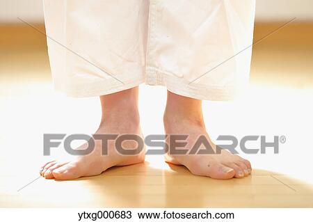Stock Image - Japanese kid in karate uniform training. Fotosearch