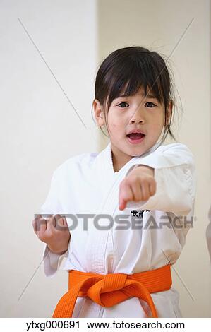 Japanese kid in karate uniform training View Large Photo Image Stock Image - Japanese kid in karate uniform training. Fotosearch