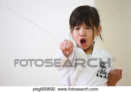 Japanese kid in karate uniform training View Large Photo Image Stock Image - Japanese kid in karate uniform training. Fotosearch