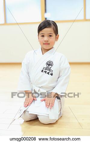 Japanese kid in karate uniform training View Large Photo Image Stock Photo - Japanese kid in karate uniform training. Fotosearch