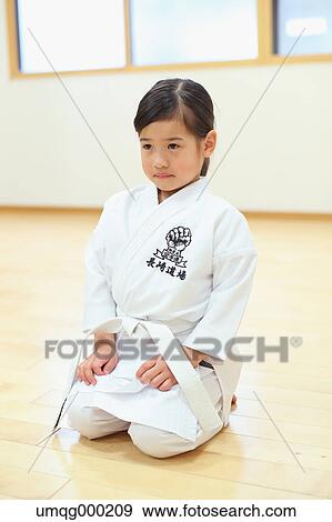 Stock Photo - Japanese kid in karate uniform training. Fotosearch