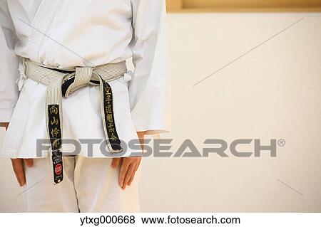 Japanese kid in karate uniform training View Large Photo Image Stock Photo - Japanese kid in karate uniform training. Fotosearch