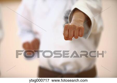 Japanese kid in karate uniform training View Large Photo Image Stock Photo - Japanese kid in karate uniform training. Fotosearch