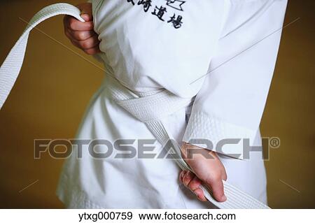 Japanese kid in karate uniform training View Large Photo Image Stock Photo - Japanese kid in karate uniform training. Fotosearch