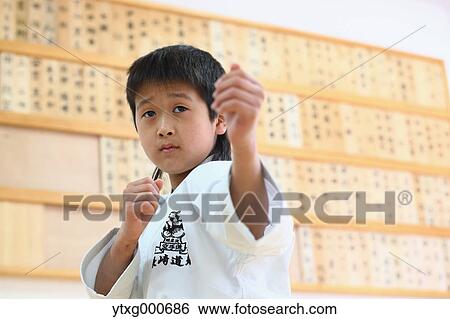 Japanese kid in karate uniform training View Large Photo Image Stock Photograph - Japanese kid in karate uniform training. Fotosearch