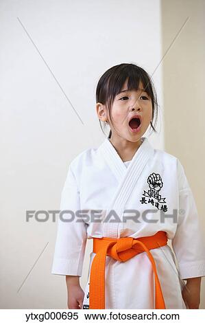 Japanese kid in karate uniform training View Large Photo Image Stock Photography - Japanese kid in karate uniform training. Fotosearch