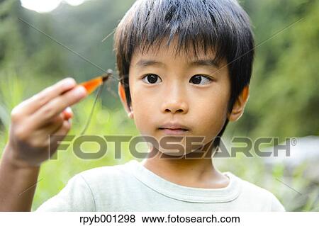 Japanese kid playing at the river View Large Photo Image Stock Photo - Japanese kid playing at the river. Fotosearch