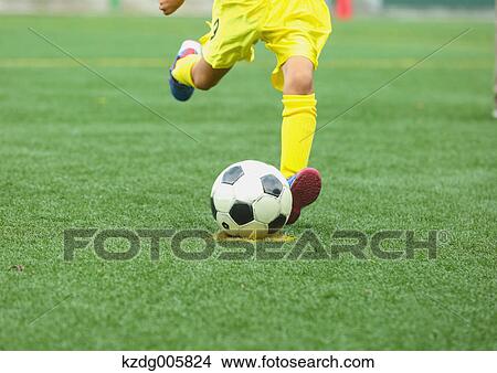 Japanese kid playing soccer View Large Photo Image Picture - Japanese kid playing soccer. Fotosearch
