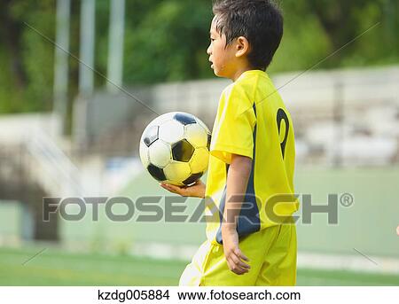 Japanese kid playing soccer View Large Photo Image Picture - Japanese kid playing soccer. Fotosearch