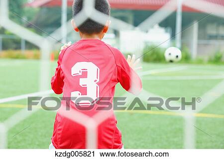 Japanese kid playing soccer View Large Photo Image Stock Image - Japanese kid playing soccer. Fotosearch