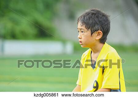 Japanese kid playing soccer View Large Photo Image Stock Image - Japanese kid playing soccer. Fotosearch