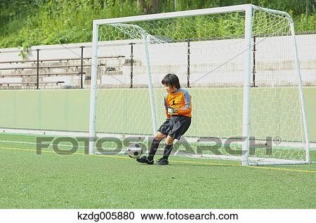Japanese kid playing soccer View Large Photo Image Stock Image - Japanese kid playing soccer. Fotosearch