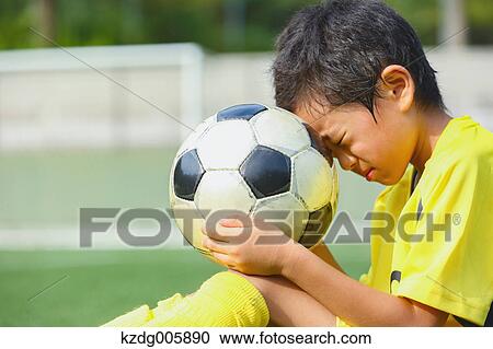 Japanese kid playing soccer View Large Photo Image Stock Image - Japanese kid playing soccer. Fotosearch