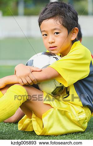 Japanese kid playing soccer View Large Photo Image Stock Image - Japanese kid playing soccer. Fotosearch