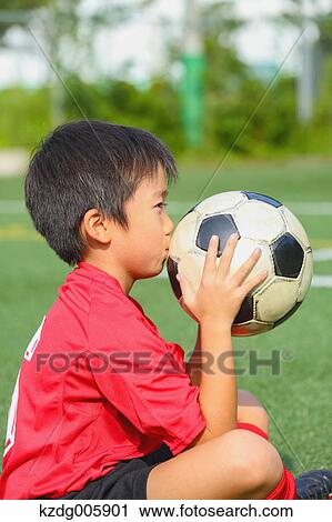 Japanese kid playing soccer View Large Photo Image Stock Image - Japanese kid playing soccer. Fotosearch