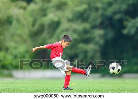 Japanese kid playing soccer View Large Photo Image Stock Image - Japanese kid playing soccer. Fotosearch