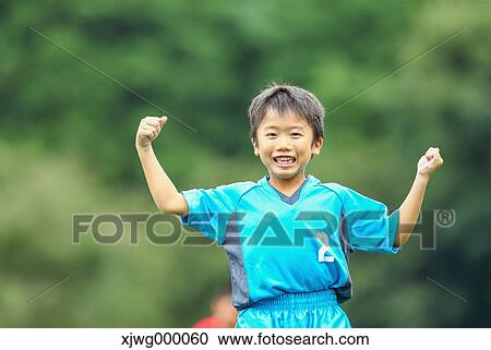 Japanese kid playing soccer View Large Photo Image Stock Image - Japanese kid playing soccer. Fotosearch