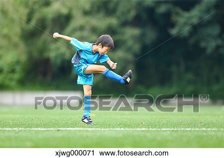 Japanese kid playing soccer View Large Photo Image Stock Image - Japanese kid playing soccer. Fotosearch