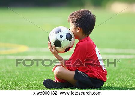 Japanese kid playing soccer View Large Photo Image Stock Image - Japanese kid playing soccer. Fotosearch