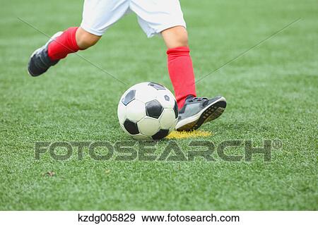 Japanese kid playing soccer View Large Photo Image Stock Photo - Japanese kid playing soccer. Fotosearch