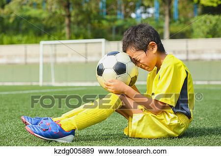Japanese kid playing soccer View Large Photo Image Stock Photo - Japanese kid playing soccer. Fotosearch