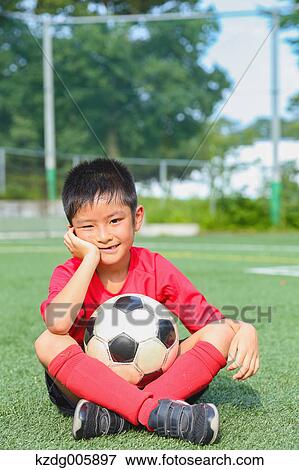 Japanese kid playing soccer View Large Photo Image Stock Photo - Japanese kid playing soccer. Fotosearch