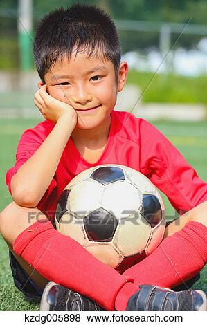 Japanese kid playing soccer View Large Photo Image Stock Photo - Japanese kid playing soccer. Fotosearch