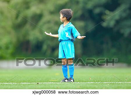 Japanese kid playing soccer View Large Photo Image Stock Photo - Japanese kid playing soccer. Fotosearch