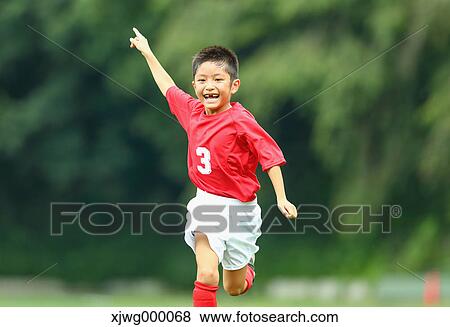 Japanese kid playing soccer View Large Photo Image Stock Photo - Japanese kid playing soccer. Fotosearch