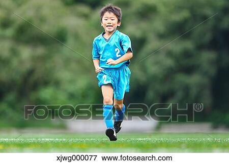 Japanese kid playing soccer View Large Photo Image Stock Photo - Japanese kid playing soccer. Fotosearch
