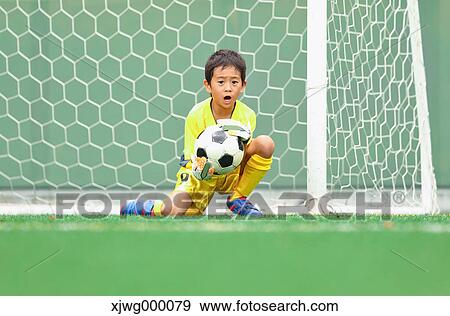 Japanese kid playing soccer View Large Photo Image Stock Photo - Japanese kid playing soccer. Fotosearch