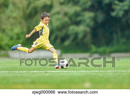 Japanese kid playing soccer View Large Photo Image Stock Photograph - Japanese kid playing soccer. Fotosearch