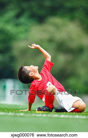 Japanese kid playing soccer View Large Photo Image Stock Photograph - Japanese kid playing soccer. Fotosearch