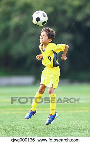 Japanese kid playing soccer View Large Photo Image Stock Photograph - Japanese kid playing soccer. Fotosearch
