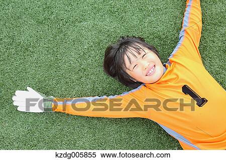 Japanese kid playing soccer View Large Photo Image Stock Photography - Japanese kid playing soccer. Fotosearch