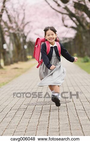 Japanese kid with cherry blossoms in a city park View Large Photo Image Stock Photo - Japanese kid with cherry blossoms in a city park. Fotosearch