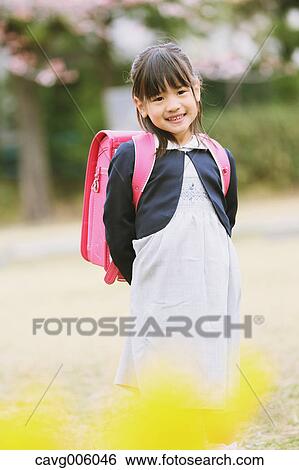 Japanese kid with cherry blossoms in a city park View Large Photo Image Stock Photograph - Japanese kid with cherry blossoms in a city park. Fotosearch