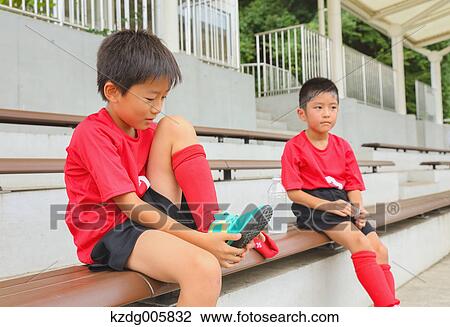 Stock Image - Japanese kids at soccer field. Fotosearch