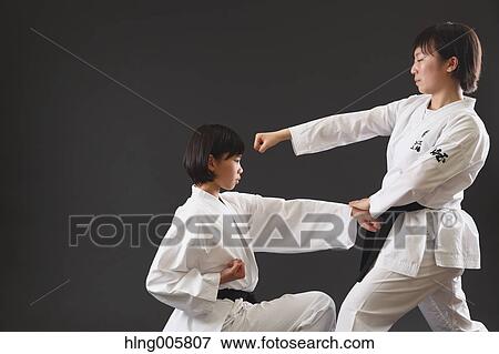 Japanese kids in karate uniform on black background View Large Photo Image Stock Photo - Japanese kids in karate uniform on black background. Fotosearch
